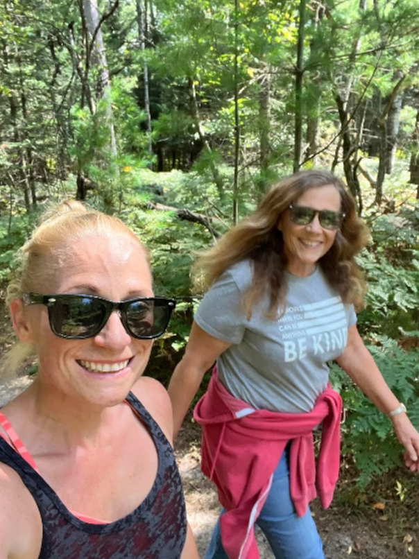 Two women walking together outside