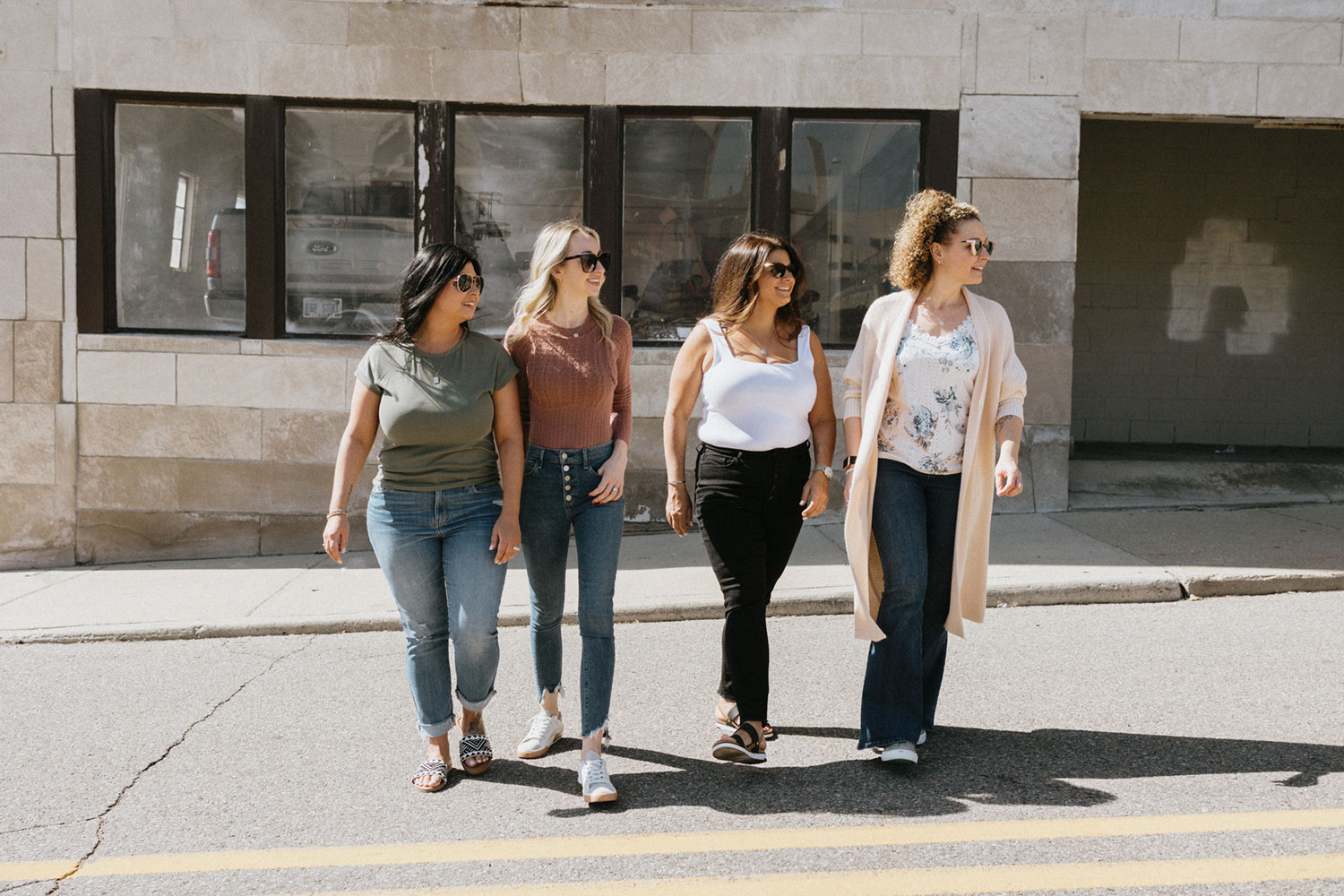 Simply Sales team wearing sunglasses and crossing the street